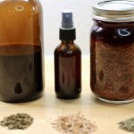 Guide to Herbal Remedies 3 piles of dry herbs in front and 3 bottles of herbal remedies behind