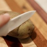 Slicing a potato with a knife