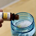 Putting lemon essential oil into DIY Sink and Tub Scrub
